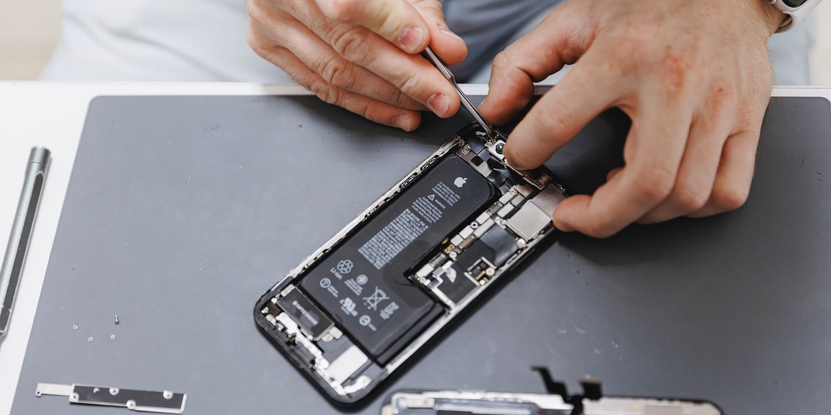 /bc/images/a-man-repairing-an-iphone.jpg /bc/images/a-man-repairing-an-iphone.jpg