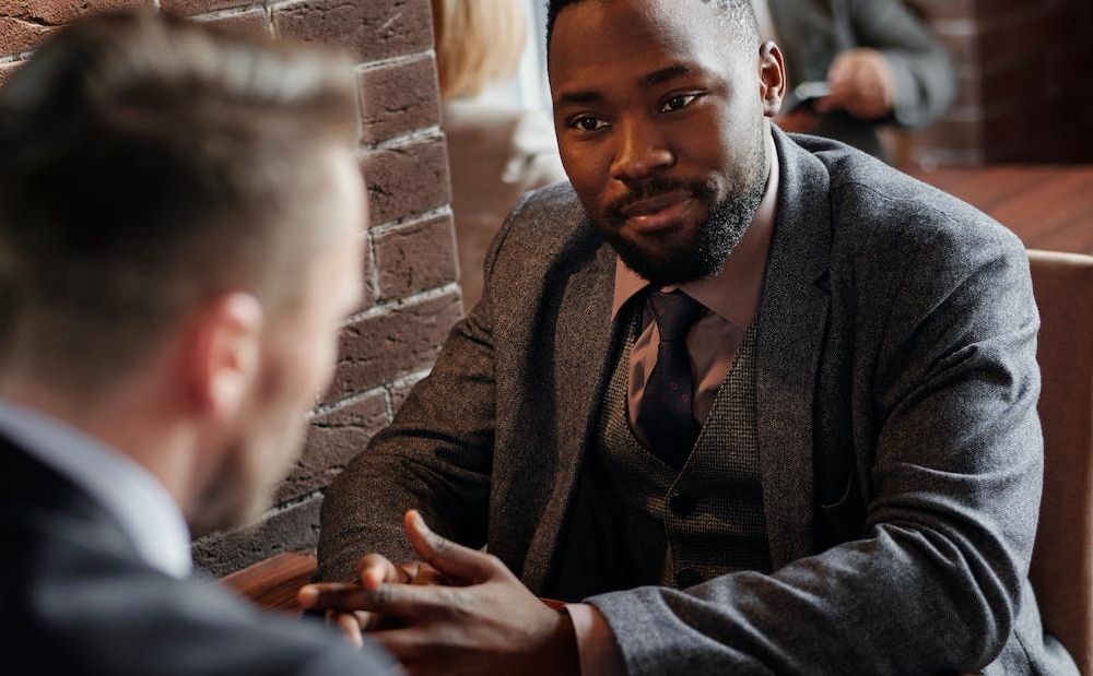 /bc/images/two-people-in-suits-seated-at-a-table.jpg /bc/images/two-people-in-suits-seated-at-a-table.jpg