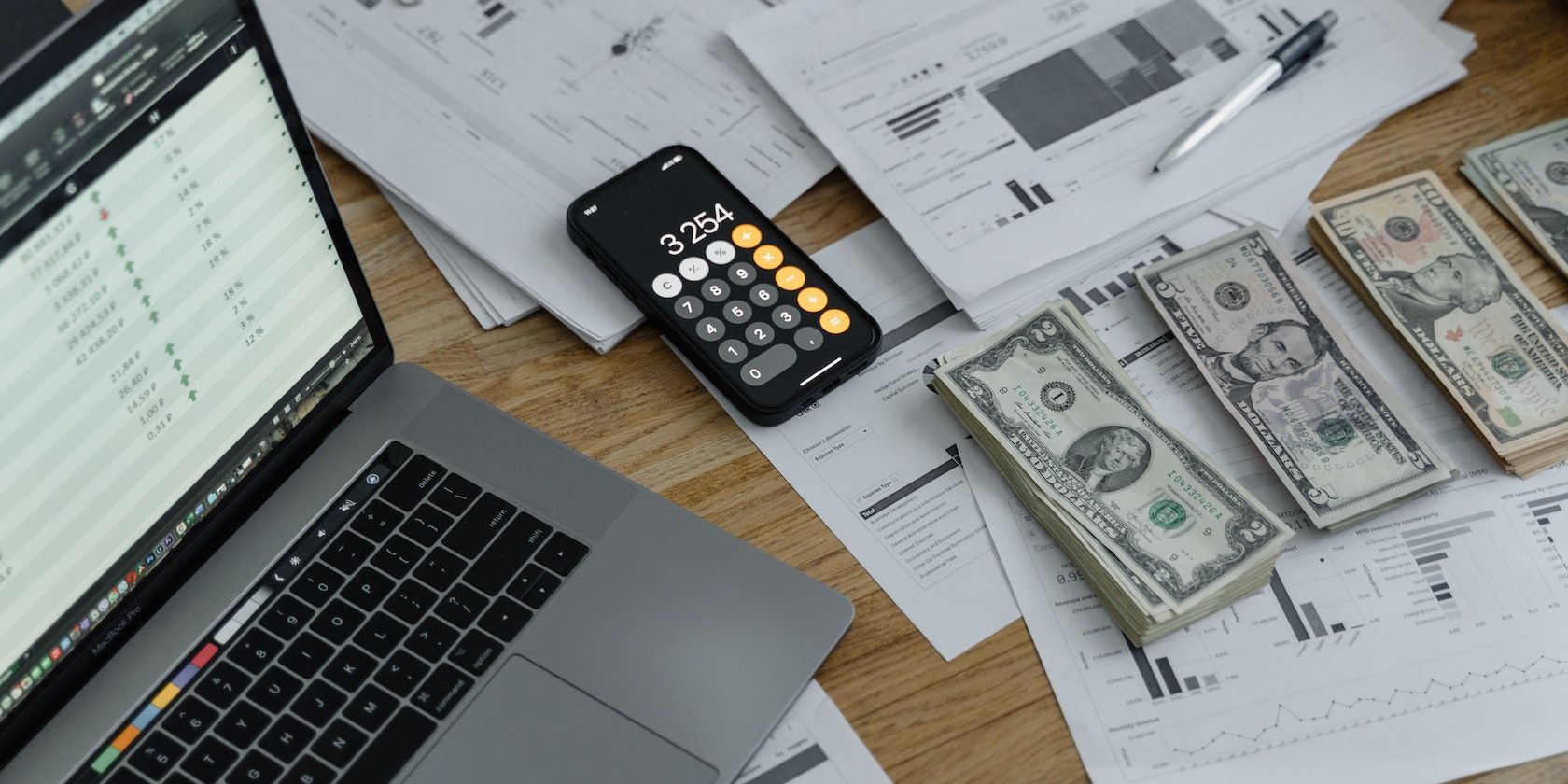 /bc/images/wads-of-cash-a-laptop-a-phone-and-graphs-showing-earnings.jpg /bc/images/wads-of-cash-a-laptop-a-phone-and-graphs-showing-earnings.jpg