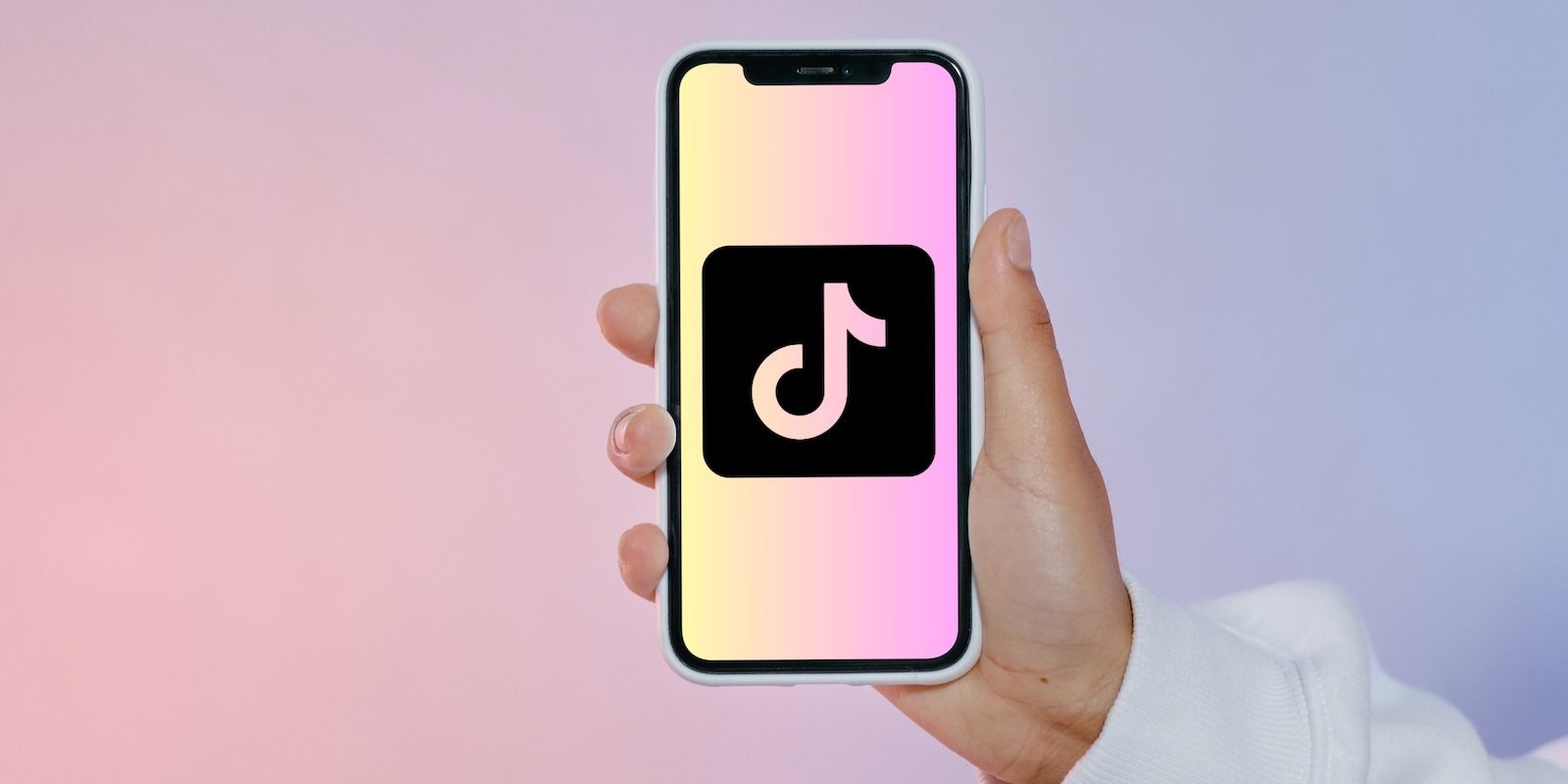 /pt/images/tiktok-logo-phone-and-colored-background.jpg