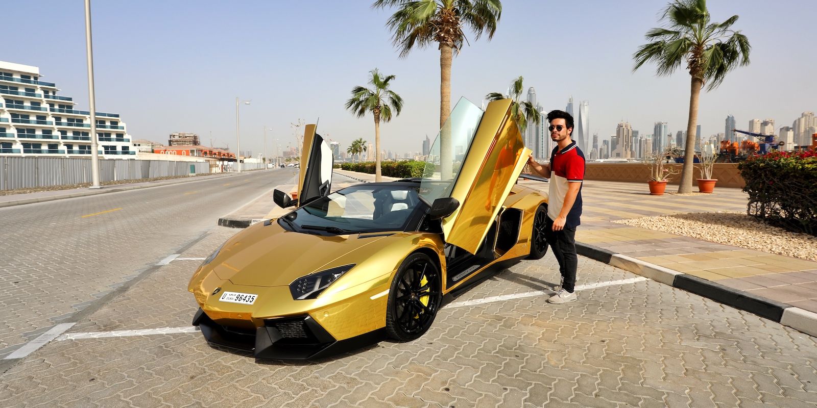 /sv/images/man-with-gold-lamborgini.jpg