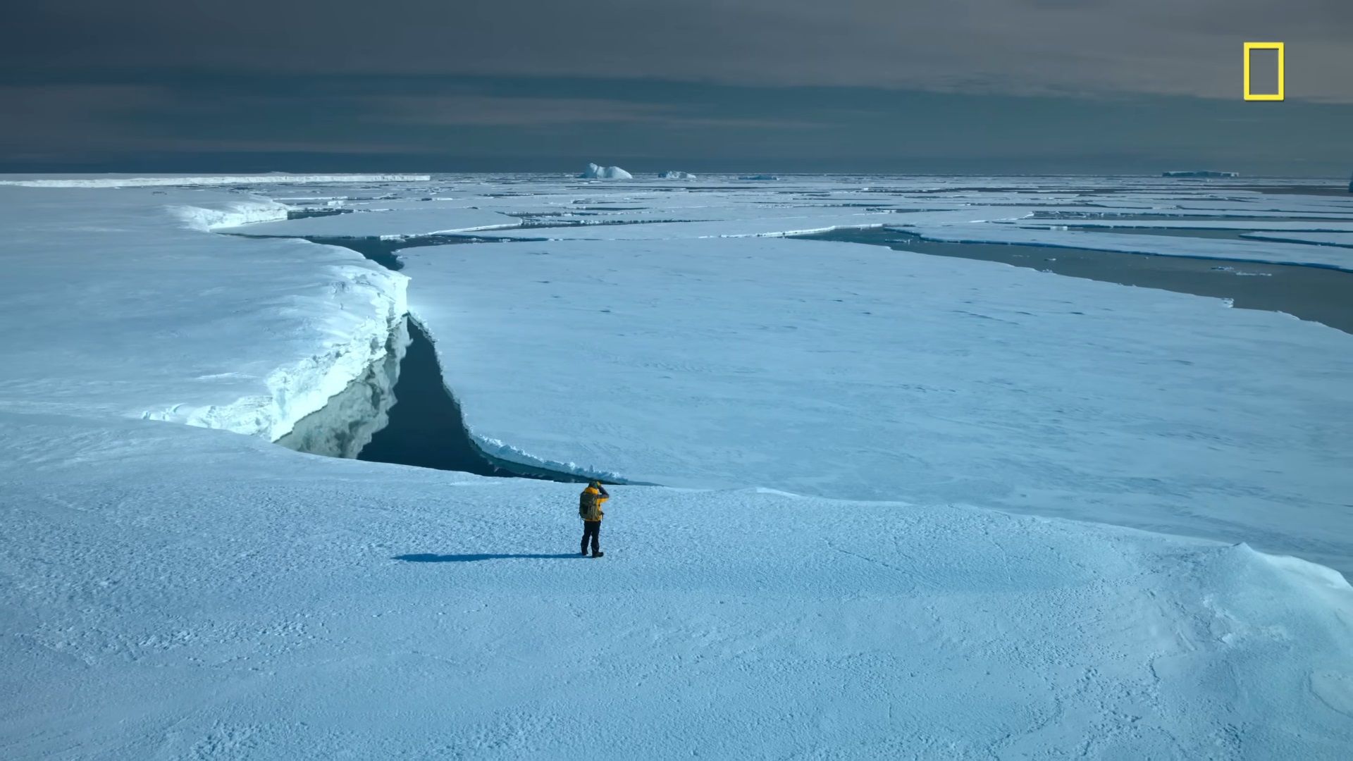 /sv/images/national-geograpic-screenshot-man-standing-on-glacier.jpg
