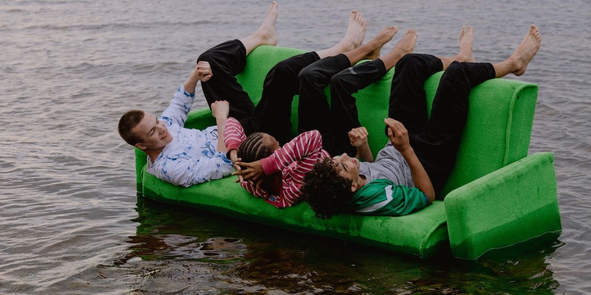 /th/images/young-men-on-a-green-sofa-inside-water.jpg