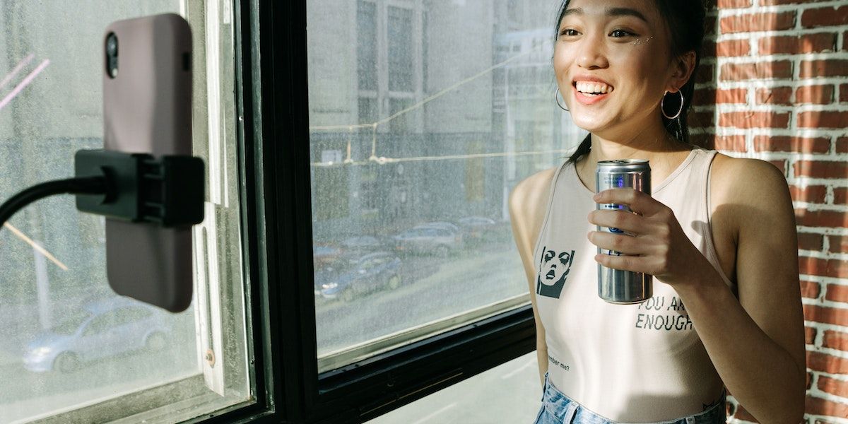 /vi/images/girl-holding-drink-recording-herself.jpg /vi/images/girl-holding-drink-recording-herself.jpg