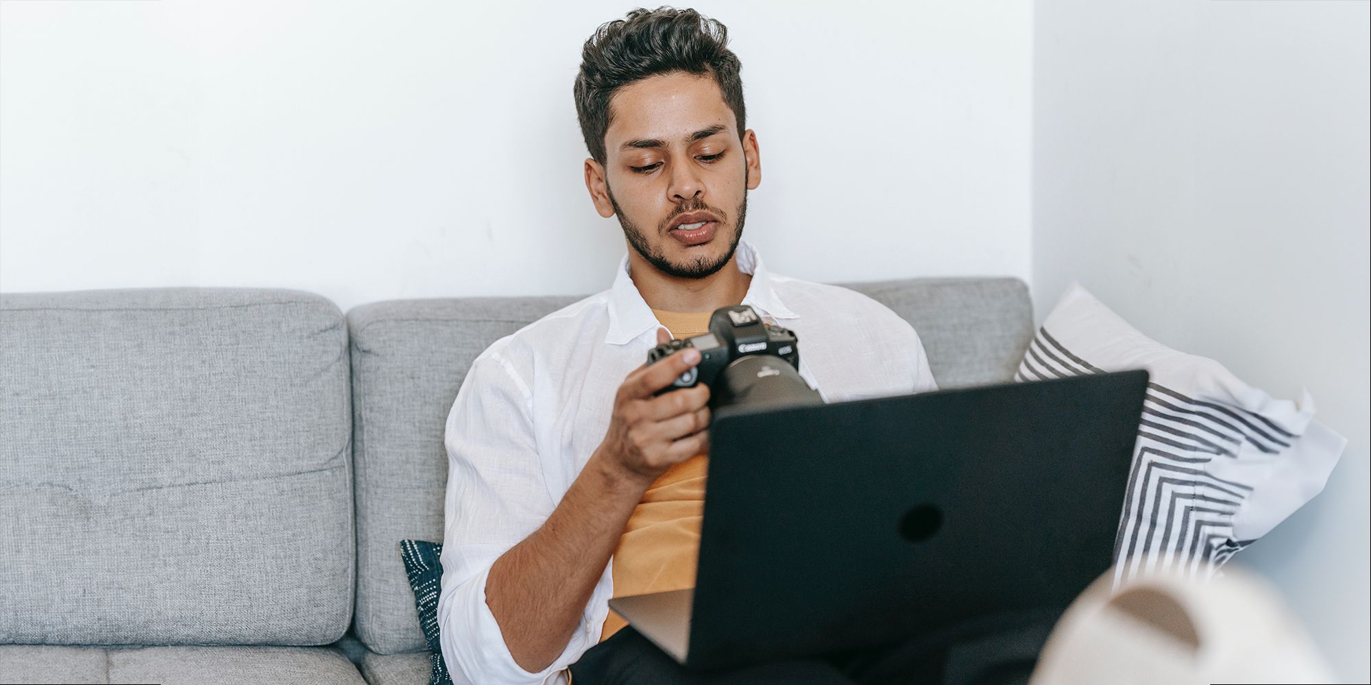 /vi/images/man-sitting-with-his-laptop-checking-camera-settings.jpg /vi/images/man-sitting-with-his-laptop-checking-camera-settings.jpg