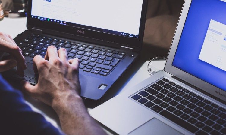 /vi/images/man-working-on-two-computers.jpg /vi/images/man-working-on-two-computers.jpg